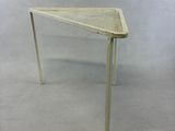 an image of a white table with a basket on top