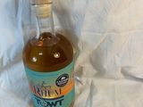 a bottle of liquor sitting on a table with a price tag on it