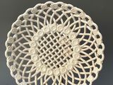 an image of a white plate with a decorative design on it