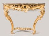 une table console en or avec un plateau en marbre