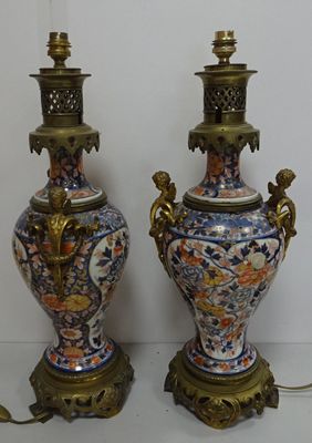 two vases that are sitting next to each other on a table
