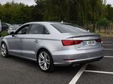 a silver car that is parked in a parking lot