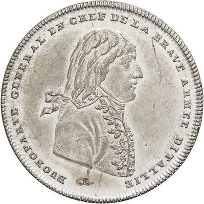 a close up of a silver coin with a woman on it