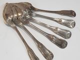 a lot of silver spoons and spoon spoons on the table