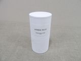 a white cup that is sitting on a table