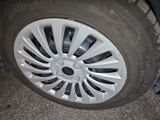 a close up view of a tire on a car