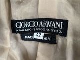 the label on the back of a white shirt reads, ' giorgio armani '