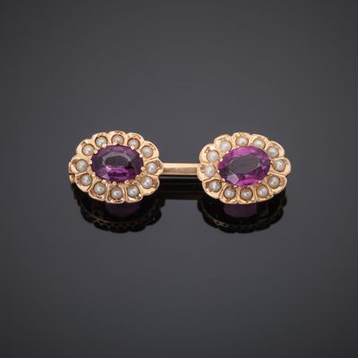 a pair of amethorate and pearl earrings