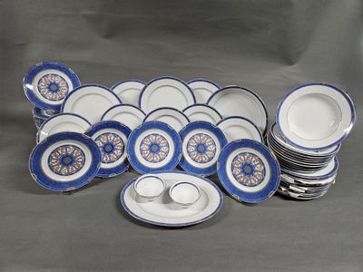 a lot of blue and white plates and cups and saucers