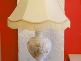 a lamp that is sitting on a table in a room