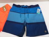 a pair of men ' s swim trunks with orange and blue stripes