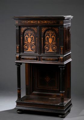 an antique wooden cabinet with a carved design on the front and sides