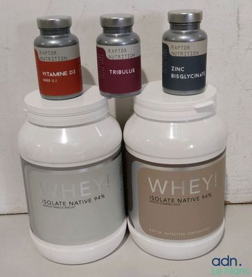 three bottles of whey are sitting next to each other on a counter