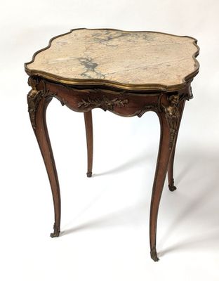 an image of a small table with a marble top on a white background