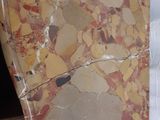 a piece of marble sitting on top of a piece of paper