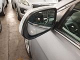 many cars parked in a parking lot next to each other