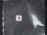 a picture of a piece of plastic with a number 9 on it