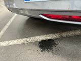 a car that has a sticker on the back of it ' s bumper