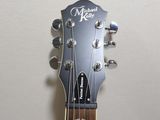 the neck of a guitar that is sitting on a table