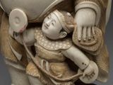 an image of a statue of a woman holding a child
