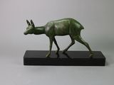 bronze statue of a deer on a black base