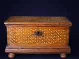 an old wooden chest with a lock on top of it