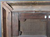 a picture of an old wooden cabinet with a broken door