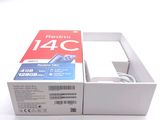 a box with a charger inside of it on a white surface