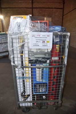 a cart with a lot of items on it in a warehouse