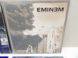 two cd ' s sitting on top of a table next to each other