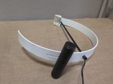 a white headband with a black tube attached to it