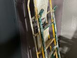 a ladder that is leaning against a wall in a room