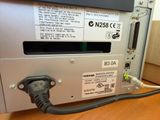 a close up of a computer with a cable connected to it