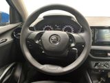 the interior of a car with a steering wheel and dashboard controls