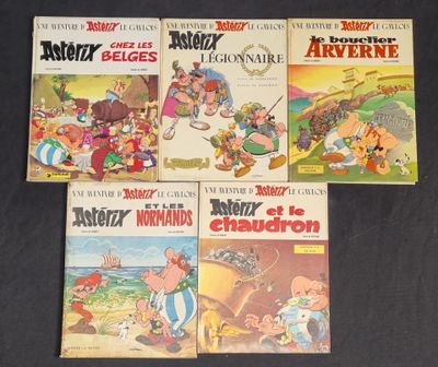 four cartoon books of various ages and sizes on a black surface