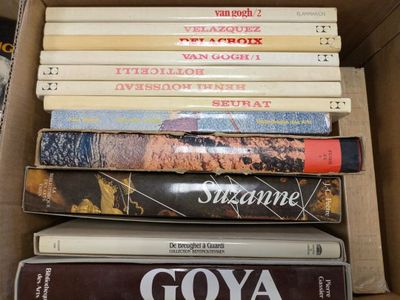 a lot of books in a box on the table