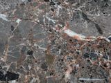 a close up view of a marble floor with black and red colors