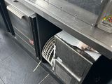 an image of a commercial kitchen with stainless steel appliances