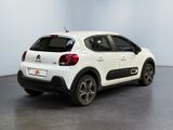 the rear of a white citrole parked in a white room