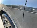 a close up of a car ' s wheel on the road