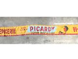 a yellow and red sign on the side of the road