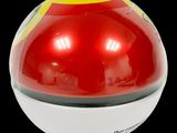 a red and yellow ball with a black background