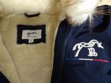a close up of a jacket with a horse on it