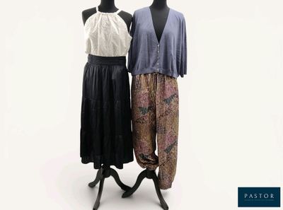 two mannequins are standing next to each other in front of a white background