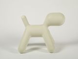 a small white dog shaped object on a white surface