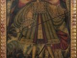 tableau représentant un ange tenant un arc et une flèche, dans un cadre doré