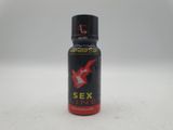 un gros plan d'un flacon de parfum « Sex Line » posé sur une surface blanche