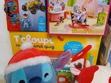 a stuffed animal and other toys sitting on a table