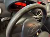 a close up of a steering wheel in a car
