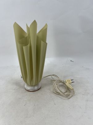 a light that is sitting on a table next to a lamp